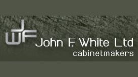 John F White